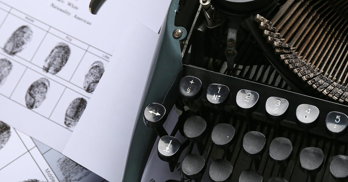 Retro,Typewriter,,Handcuffs,,Wanted,Poster,And,Fingerprints,,Closeup